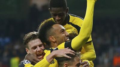 Dortmund players celebrate after Marco Reus scored his side's 2nd goal against Real Madrid. Francisco Seco / AP