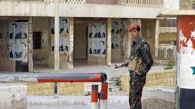 A Syrian soldier outside the Beirut headquarters of the Syrian army intelligence, March 5, 2005. AFP