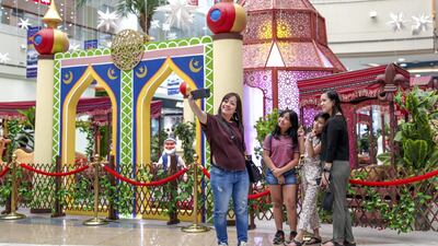 Visitors at Al Wahda mall enjoy the Eid mini village. Victor Besa / The National