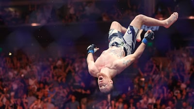 Justin Gaethje celebrates his KO of Dustin Poirier with a back flip off the octagon. Reuters