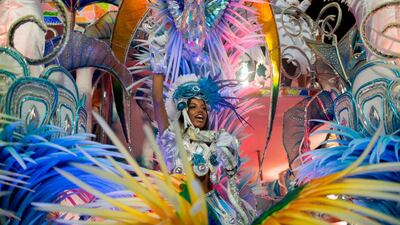 A reveller of the Beija-Flor samba school performs during the second night of Rio's Carnival at the Sambadrome in Rio de Janeiro, Mauro Pimentel / AFP Photo
