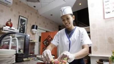 Marites Rico prepares a meal at Bentoya Kitchen.