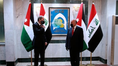 Iraqi Foreign Minister Fuad Hussein met Jordanian counterpart Ayman Safadi in Baghdad on Wednesday. AP