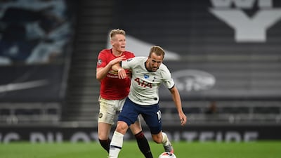 Scott McTominay tackles Harry Kane during the Premier League match between Tottenham Hotspur and Manchester United. AP Photo