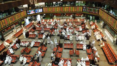 Kuwaiti traders are pictured at the Kuwaiti stock exchange in Kuwait City. The index was down 4.8 per cent last month. EPA