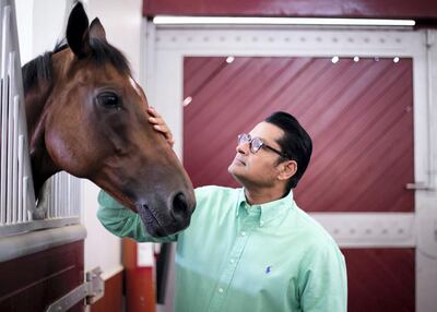 Satish Seemar, one of the longest serving and most successful racehorse trainers in the UAE, at Zabeel Stables. Reem Mohammed / The National