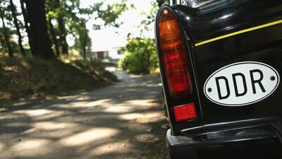 An East German country plate is seen on a Trabant automobile at a Trabant enthusiasts' weekend. Adam Berry / Getty Images