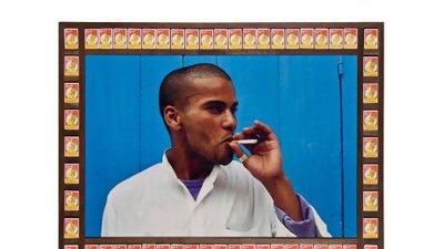 'Blue Boy' by the Moroccan artist Hassan Hajjaj is one of the works displayed at the Third Line gallery. It riffs on constructed notions of what is anti-social behaviour, juxtaposed with found cigarette boxes sold - and therefore sanctioned - by the State. Courtesy of Hassan Hajjaj / Third Line Gallery