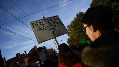 People gather to protest the arrival of Donald Trump as he visits the Tree of Life Congregation in Pittsburgh. AFP