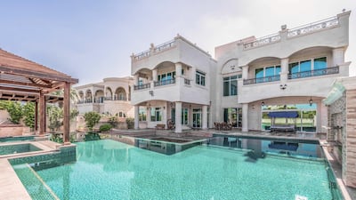 The outdoor pool includes a swim-up bar. Courtesy LuxuryProperty.com