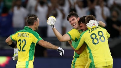Australia's Glenn Maxwell, left, celebrates hitting a four to win the Twenty20 World Cup final against New Zealand in Dubai. AP