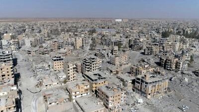 In this Thursday, October 19, 2017 file photo, a frame grab made from drone video shows damaged buildings in Raqqa, Syria. AP