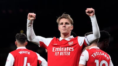 Arsenal's Martin Odegaard reacts after scoring to make it 3-0 against Everton. EPA