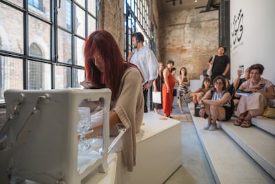 The performance unfolds around the Gossip Bench, which stores the objects used by the dancers and becomes a listening station when the live work is not taking place. Photo: National Pavilion UAE