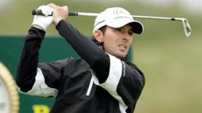 Mike Weir of Canada takes a shot from the fourth tee during the second round.