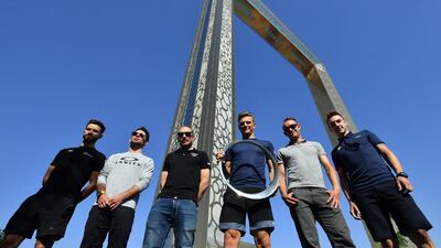 From left: Nacer Bouhanni, French rider for Cofidis, Mark Cavendish, British rider for Dimension Data, John Degenkolb, German rider for Trek Factory Racing, Marcel Kittel, German rider for Giant–Alpecin, Alexander Kristoff, Norwegian rider for UAE Team Emirates, and Elia Viviani, Italian rider for Quick-Step floors pose for a group picture in front of the Dubai Frame. Giuseppe Cacace / AFP