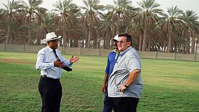 Andy Atkinson, in charge of the pitches for the ICC, right, inspects the facilities at Al Dhaid Cricket Village.