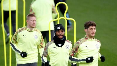 Manchester City's Kevin De Bruyne, left, Raheem Sterling, centre, and John Stones during a team training session before their Champions League Group C match against Shakhtar Donetsk. PA