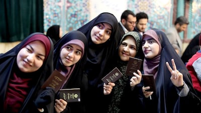 Voters pose for a selfie during the parliamentary elections at a polling station in Tehran, Iran. Iranians began voting for a new parliament on Friday, with turnout seen as a key measure of support for Iran's leadership as sanctions weigh on the economy and isolate the country diplomatically. AP Photo