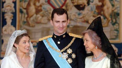 Spanish Crown Prince Felipe de Borbon with his wife Princess Letizia, a former journalist, on their wedding day on May 22, 2004, along with his mother Queen Sofia. The couple are now the ruling king and queen of the European nation. EPA