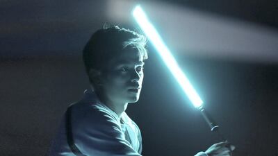 A dancer performs with light staffs during the Opening Ceremony of the Special Olympics. Chris Whiteoak / The National