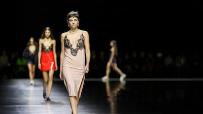 Models in lingerie-slip dresses at Gucci spring/summer 2024. Reuters