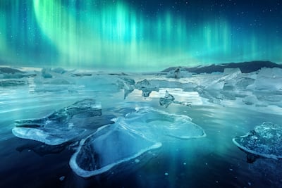 Aurora borealis northen light and icebergs in Jokulsarlon glacial lagoon in Iceland. Getty Images