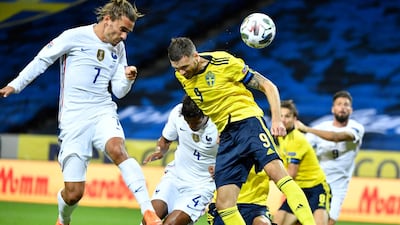 France's Antoine Griezmann in action against Sweden's Marcus Berg. EPA
