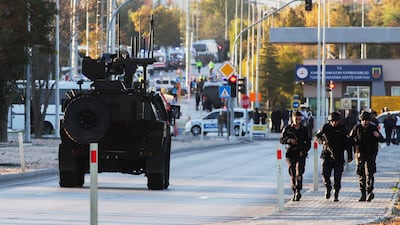 Emergency and security teams outside the Turkish state-run aerospace and defence company. AP