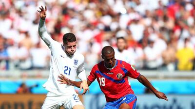 Roy Miller of Costa Rica competes for the ball with Ross Barkley, left, and Adam Lallana of England during the 2014 World Cup on Tuesday. Ian Walton / Getty Images