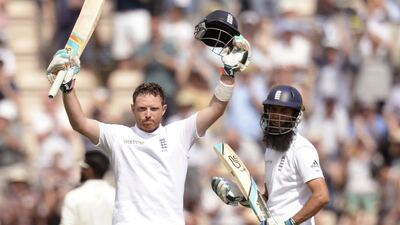 England's Ian Bell, left, celebrates reaching his century as team-mate Moeen Ali looks on during the third cricket test match against India at the Rose Bowl cricket ground, Southampton, England July 28, 2014. REUTERS/Philip Brown