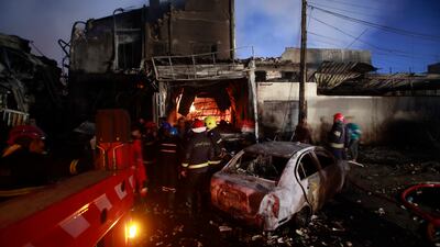 The building in Baghdad’s northern district of Waziriyah was used as a warehouse for oil-based perfumes. AP