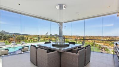 Its top-floor lounge has a 360-degree view of the surrounding area including the coast, an outdoor dining area and a swimming pool. Courtesy Kensington Exclusive Properties