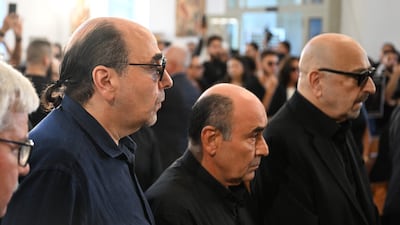 Rahbani's cousins, from left, Oussama, Ghadi and Marwan, at his funeral ceremony. AFP