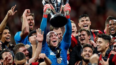 Atlanta United goalkeeper Brad Guzan hoists the trophy. AP Photo