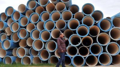 Mahmud al-Rammah shows water pipes waiting to be installed at the Zentan water pumping station in Libya. AFP