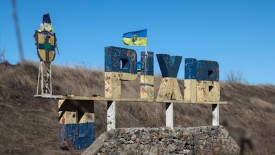 A damaged sign in the town of Orikhiv, near the front line in the Zaporizhzhia region in 2024. EPA