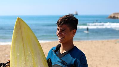 ‘Little Ali’ now works at Mr Elamine’s surf shop and school, and gets to use all the equipment there and surfs as much as he wants. Josh Wood for The National