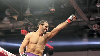 Ahmed Labban celebrates his win against Magomedsultan Magomedsultanov in the welterweight division. Chris Whiteoak / The National