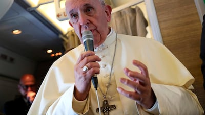 Pope Francis speaks to reporters aboard a plane on the way to Abu Dhabi on February 3, 2019. AFP