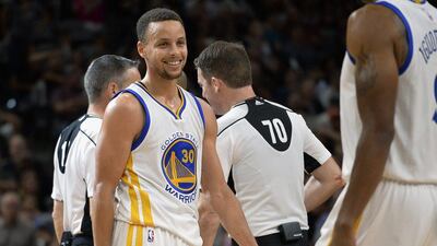 Golden State Warriors guard Stephen Curry smiles during their win over the San Antonio Spurs in the NBA on Sunday night. Darren Abate / AP / April 10, 2016