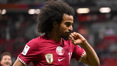 Qatar forward Akram Afif celebrates after scoring against Tajikistan. AFP