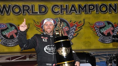 Shawn Langdon with the NHRA trophy on Saturday. Photo Courtesy Qatar Al-Anabi Racing Top Fuel Team