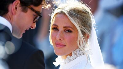 The singer's wedding gown had personal touches, including her and Jopling's initials, E and C, sewn into the collar and veil. AP