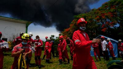 Members of the Cuban Red Cross prepare to go Matanzas, where firefighters are working to quell the blaze, which began during a thunderstorm. AP