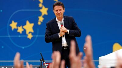 Italian prime minister Giuseppe Conte stands on stage at a 5-Star Movement rally in Rome. REUTERS