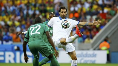 Ivory Coast's Souleyman Bamba fights for the ball with Greece's Giorgios Samaras, right, during their match at the 2014 World Cup on Tuesday. Marcelo Del Pozo / Reuters