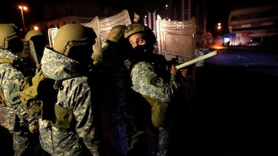 Lebanese soldiers take their position as they clash with protesters, during a protest against deteriorating living conditions and strict coronavirus lockdown measures, in Tripoli, Lebanon. AP Photo