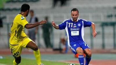 Mascara Giuseppe of Al Nasr takes on Abdulaziz Ismail of Kalba during the Etisalat Pro League match between Al Nasr and Kalba at Maktoum Bin Rashid Al Maktoum Stadium, Dubai on the 20th October 2012. Credit: Jake Badger for The National