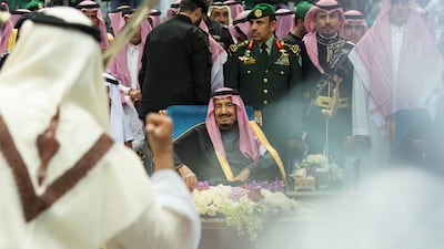 King Salman of Saudi Arabia attends a ceremony of the traditional Ardah dance at the Janadriyah cultural festival in Riyadh. Bandar Algaloud / Courtesy of Saudi Royal Court / Reuters